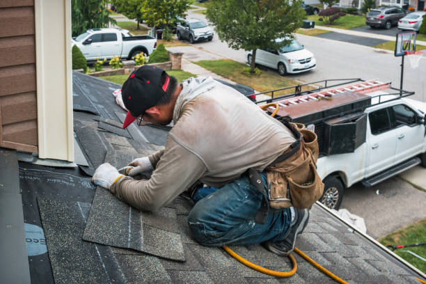 Professional Gutter Repair And Installation technician working in Massapequa Park, NY